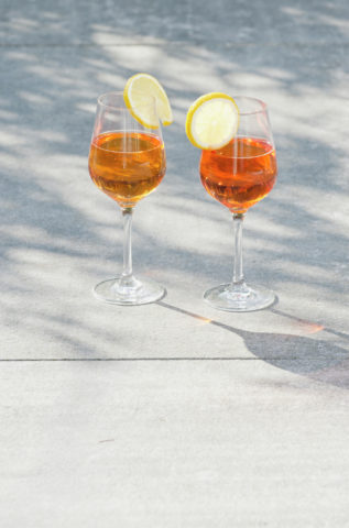Two cocktails standing on ground outdoors