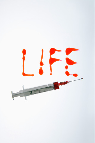 Red written word LIFE and a syringe