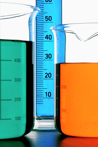 Beakers and text tube with several colored liquids
