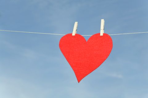 Red heart hanging on clothesline