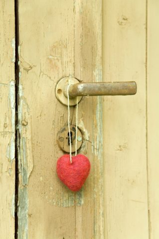 Red heart hanging at door knob