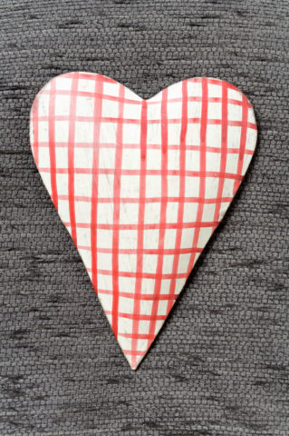 Checkered heart on gray textile