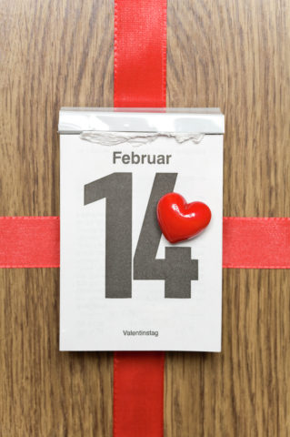 Red heart marking Valentine's Day on a calendar