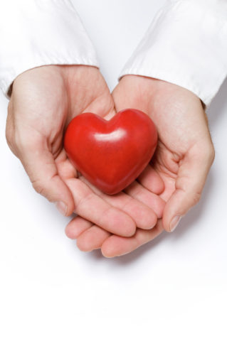 Red heart in hands