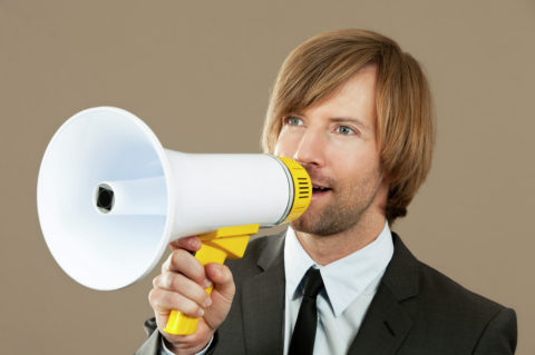 Businessman holding megaphone