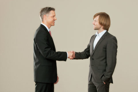 Two businessmen shaking hands