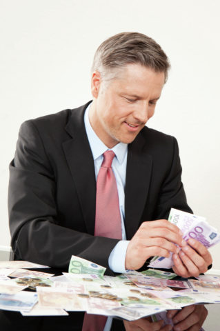 Businessman counting Euro notes
