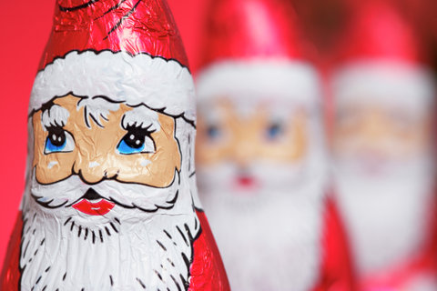 Santa Claus chocolates in a row