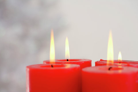 Four burning red candles