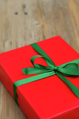 Wrapped Christmas present with green ribbon