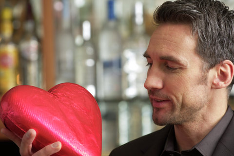Man holding a chocolate heart