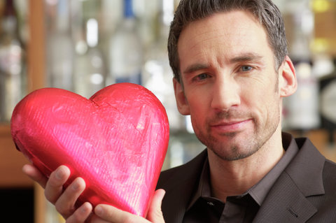 Man holding a chocolate heart