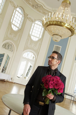 Man holding a bunch of roses