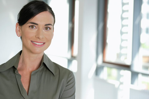 Young business woman with brunette hair, Portrait