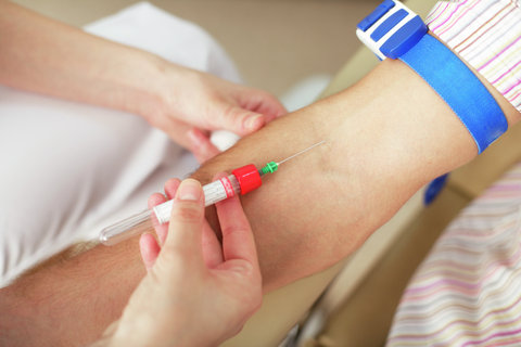 Nurse taking blood sample