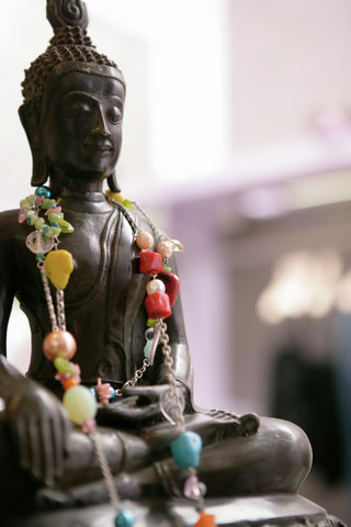 Buddha figure with necklet
