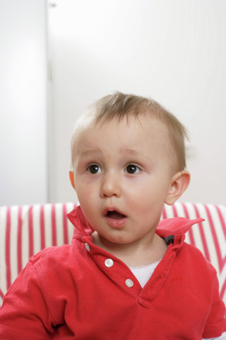 Surprised looking baby boy, portrait