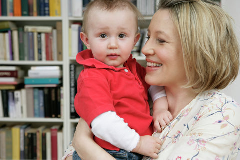 Mother carrying son, portrait