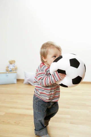 Baby boy holding a football