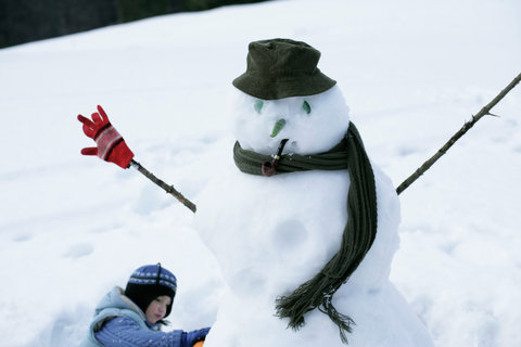 Boy making a snowman