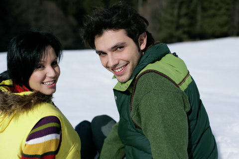 Young couple looking at camera