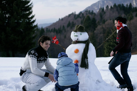 Family making a snowman