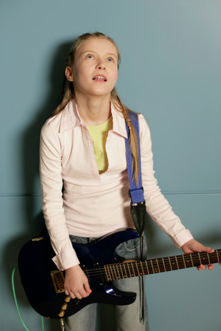Girl holding an electric guitar