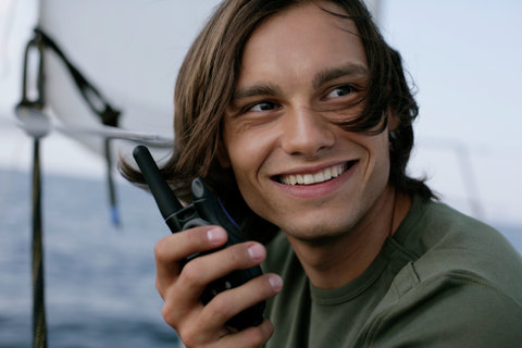 Man holding a walkie-talkie in his hands