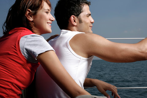 Couple sitting at sailboat border