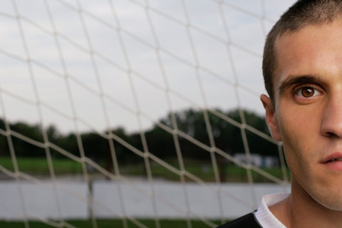 Portrait of a soccer player in front of a goal
