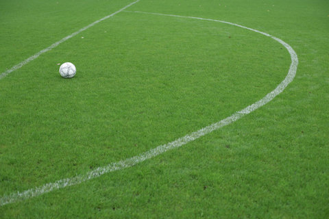 Football lying in a marked area, ready for direct free kick
