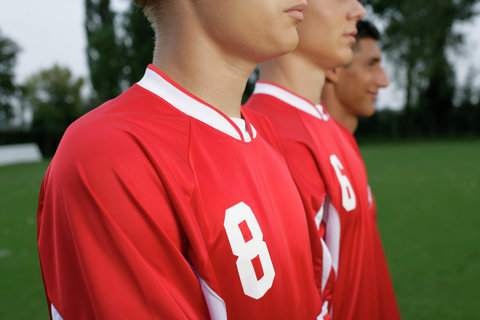 Soccer players forming a wall