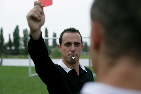 Referee showing the red card