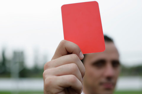 Referee showing the red card