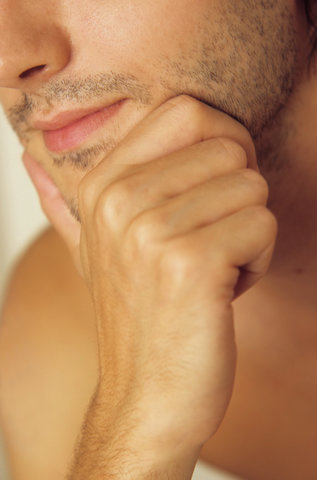Man resting his Chin with one Hand - Three-Day Beard - Masculinity