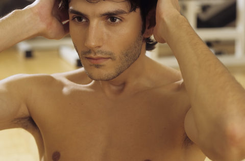 Darkhaired Man doing Sit-Ups - Physicalness - Sportiness