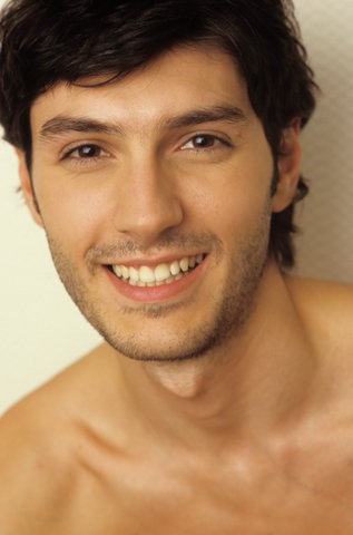 Portrait of a Darkhaired Man - Happiness - Smile - Facial Expression