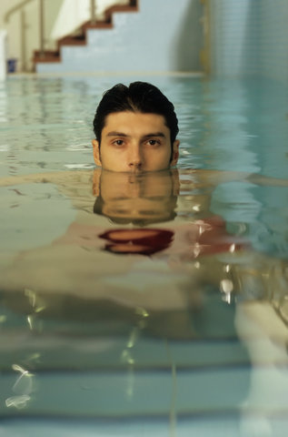 Darkhaired Man in a Swimming-Pool - Sports - Leisure Time